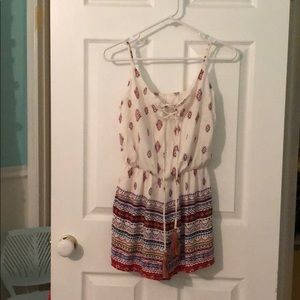 Gorgeous romper with adjustable tassels!